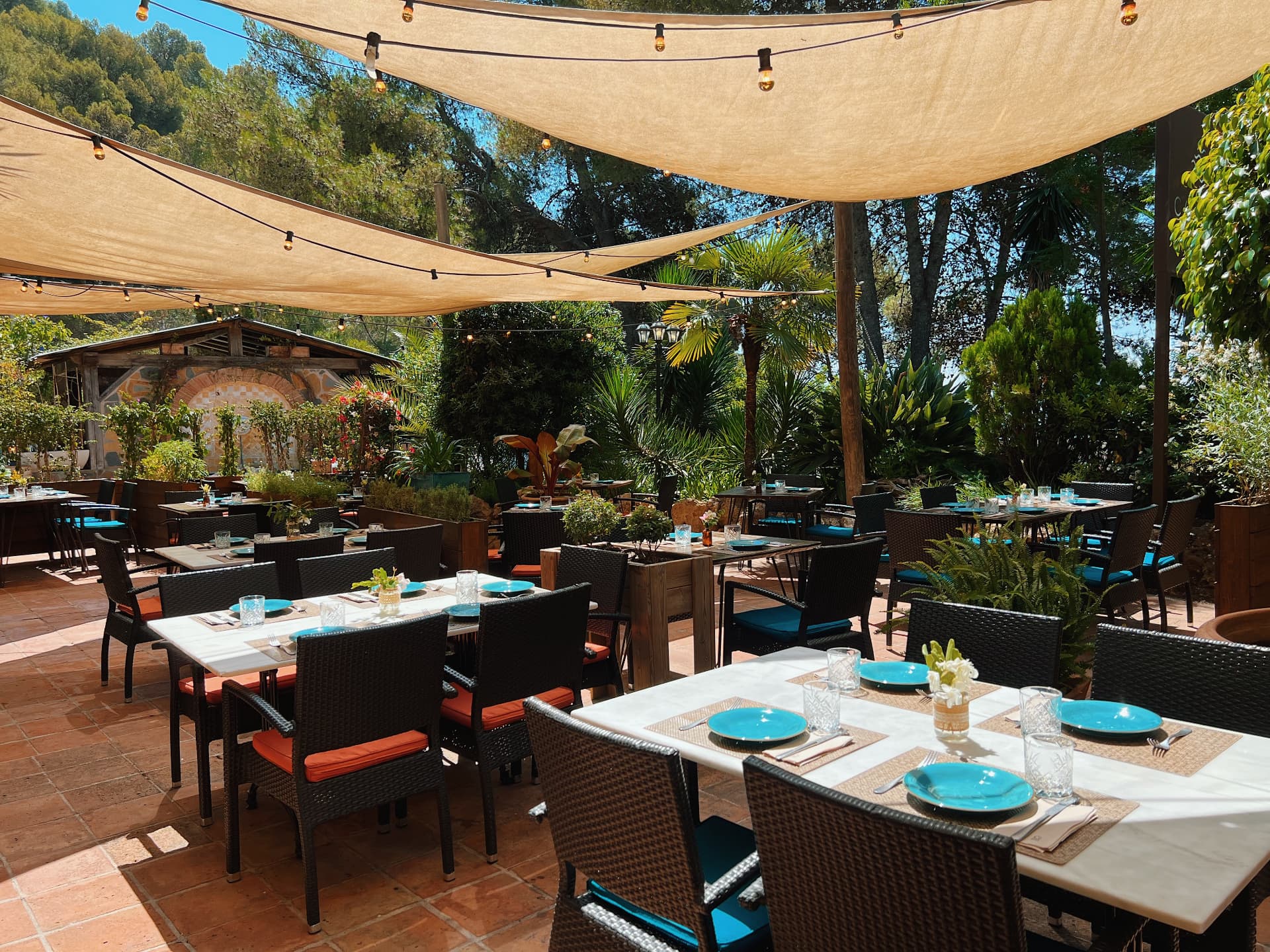 Cascada's main terrace set for lunch beneath shade sails